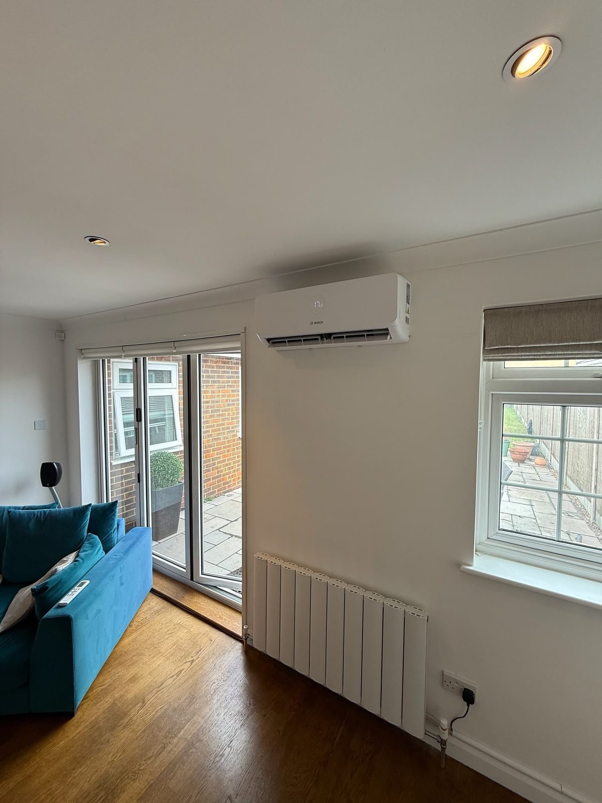 Wall-mounted air conditioning unit installed in a living room