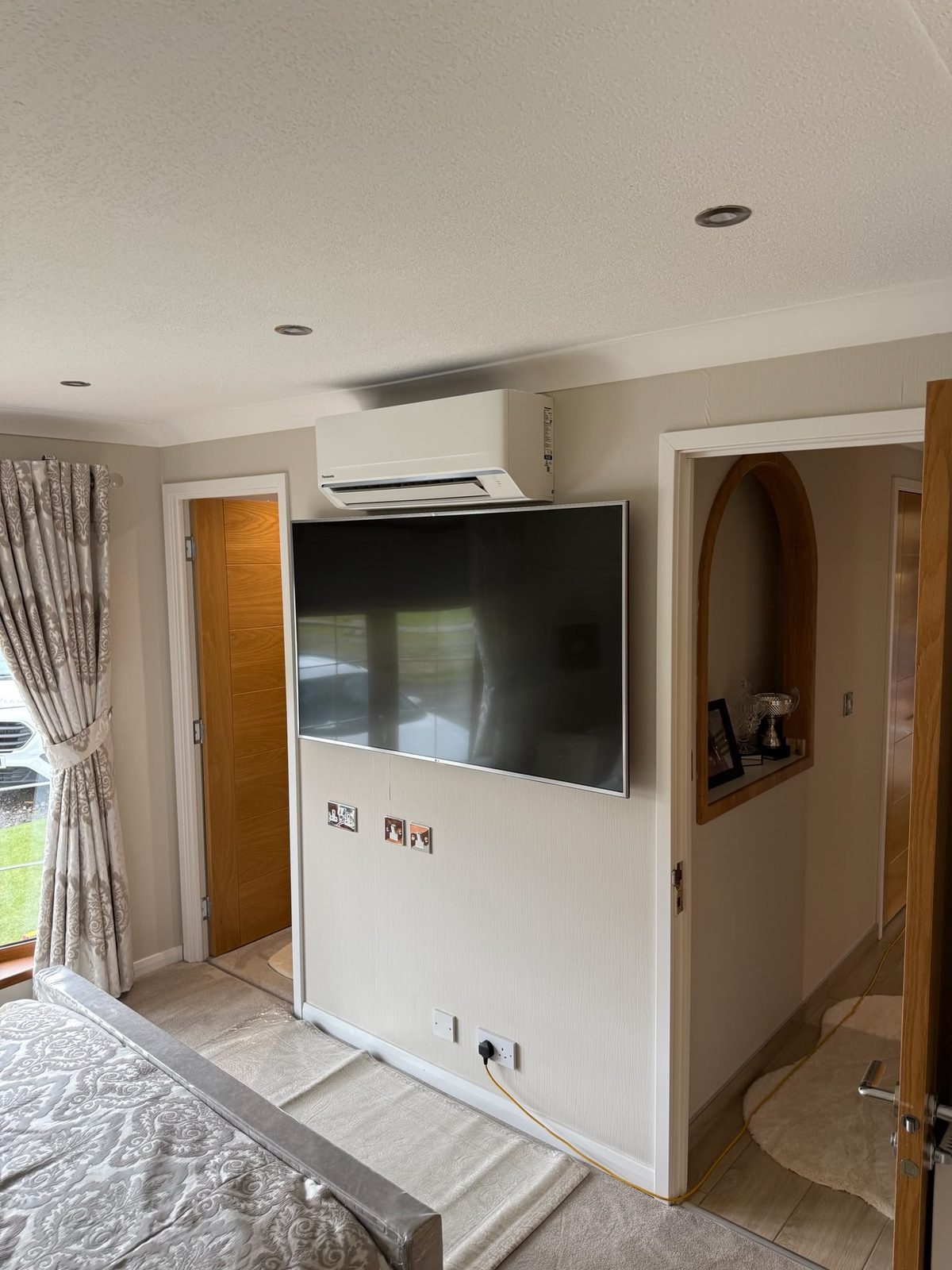 Panasonic air conditioning unit installed in a bedroom
